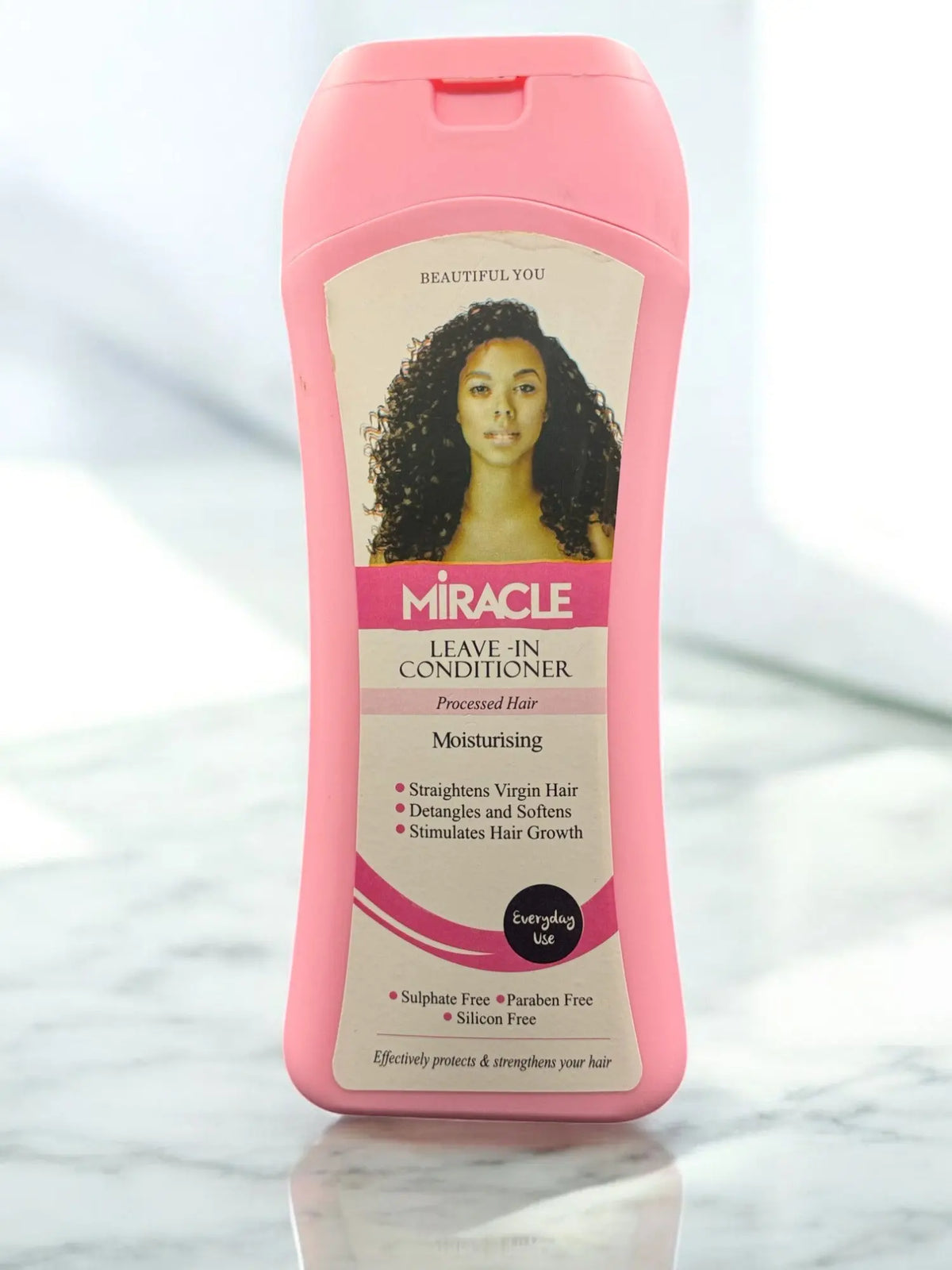 a bottle of hair conditioner sitting on a counter