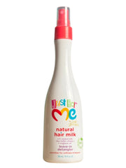 Just For Me Leave-in Detangler spray bottle features a colorful label, designed for children's hair care. The bottle is shaped with a spray nozzle and highlights its natural ingredients for detangling hair.