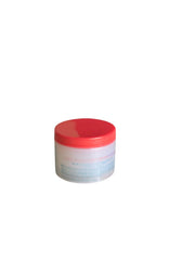 Slightly angled view of the Just For Me Soothing Scalp Balm, emphasizing the red lid and clear design of the product.